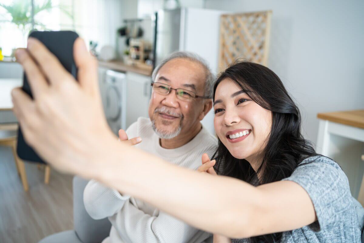 Daughter in law posing with father in law and spending time together